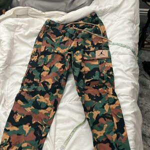 Jordan camo pants. Waterproof like material. 30 inch inseam.